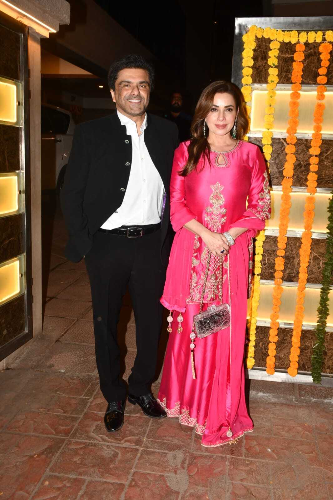 Ektaa's close friend and fabulous Bollywood wife Neelam Kothari arrived at the bash with husband Samir Soni. While Neelam looked ravishing in a red sharara set, Samir complimented her in black formal yet festive look.